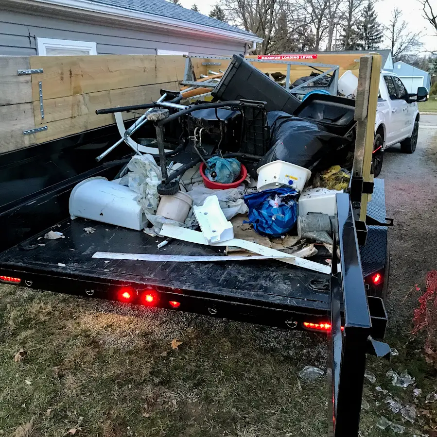 Roll-off dumpster delivered to a residential driveway in Flagler Beach