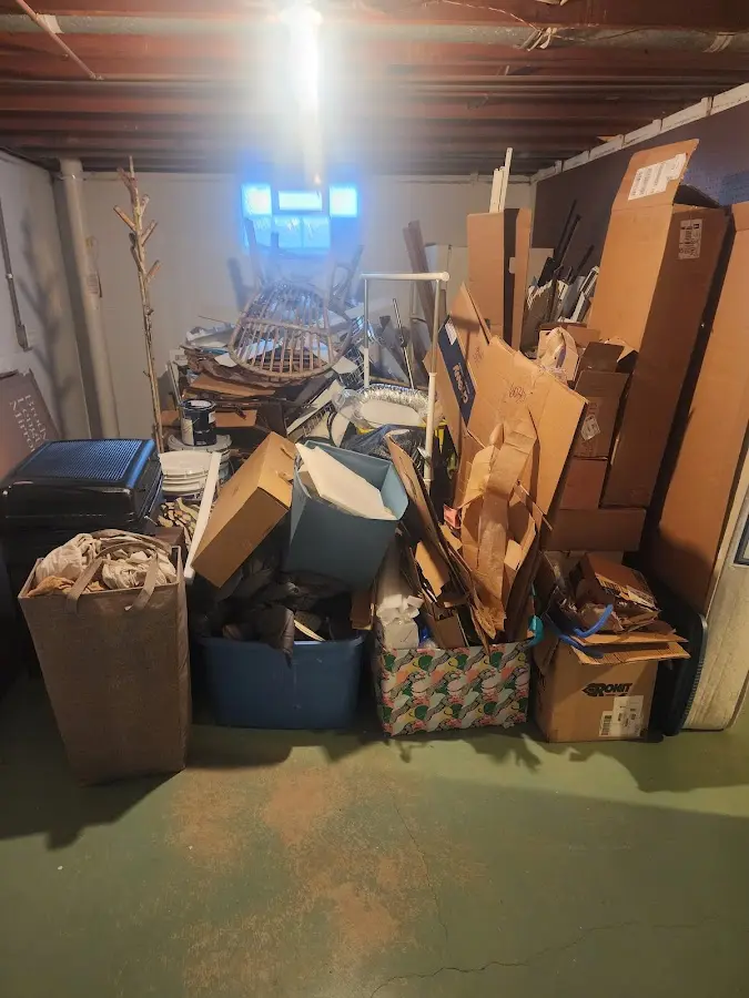 Roll-off dumpster container at job site for 4 Yard Dumpster Rental in Flagler Beach